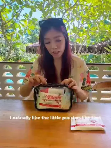 Creator opening a branded welcome kit on location